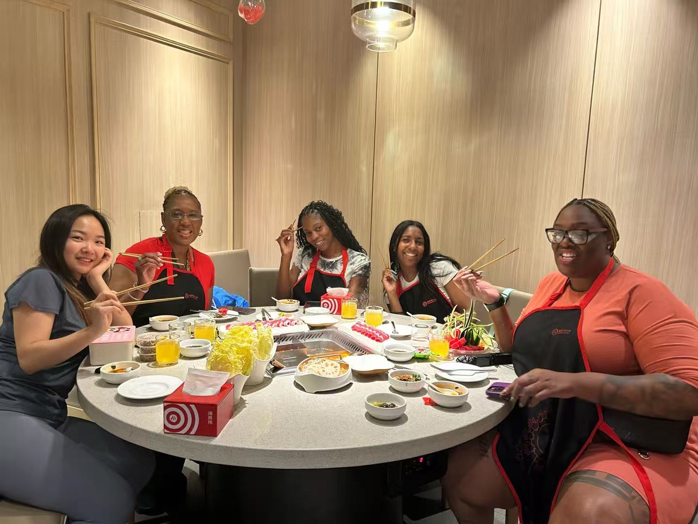 Cecilia Zhang and a U.S. buying team having hotpot after factory visits