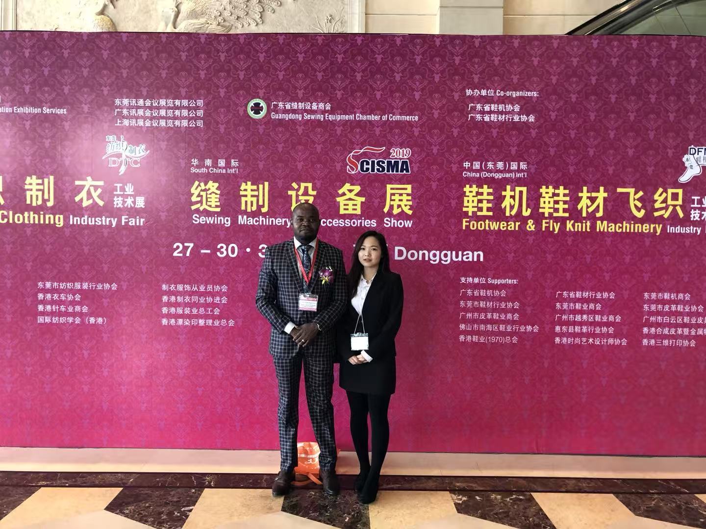 Cecilia Zhang interpreting for an Angolan consulate delegation at a sewing machinery expo, 2019